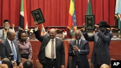South Sudan President Salva Kiir and Sudan President Omar al-Bashir take part in signing ceremony in Addis Ababa, Ethiopia. 