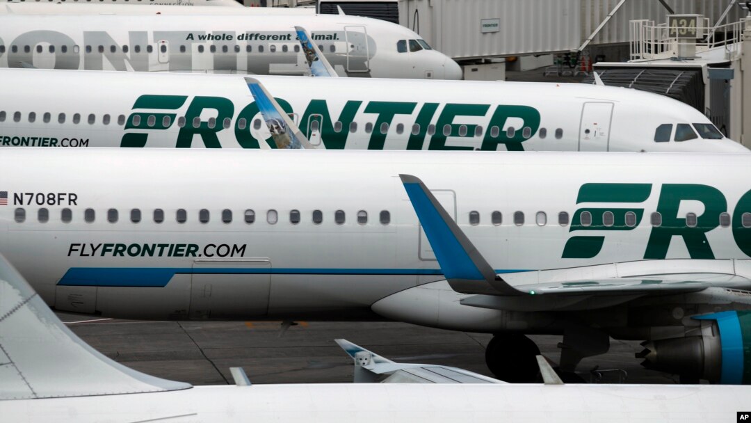 FILE - In this May 15, 2017, photo, Frontier Airlines jetliners sit at Denver International Airport in Denver.