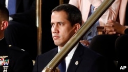 Venezuelan opposition leader Juan Guaido listens as President Donald Trump delivers his State of the Union address to a joint session of Congress on Capitol Hill in Washington, Feb. 4, 2020.