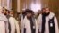 Members of the Taliban delegation are seen at the conclusion of peace talks between the Afghan government and the Taliban, in Doha, Qatar, July 18, 2021. 