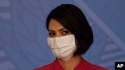 Brazil's first lady Michelle Bolsonaro wears a protective mask during an event at the presidential palace, in Brasilia, Brazil, July 29, 2020. 