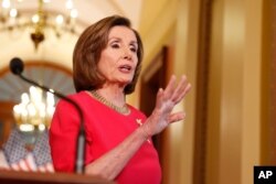 FILE - House Speaker Nancy Pelosi of Calif. speaks outside her office on Capitol Hill, March 23, 2020.