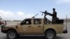 FILE - Afghan army soldiers patrol after the American military left Bagram air base, in Parwan province north of Kabul, Afghanistan, July 5, 2021. 