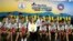 FILE - The 12 boys and their soccer coach who were rescued from a flooded cave arrive for a news conference in the northern province of Chiang Rai, Thailand, July 18, 2018. 