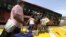 Deported Colombians prepare to board a bus that will take them to the border with Colombia, from San Antonio del Tachira, Venezuela, Aug. 25, 2015.