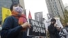 FILE - A supporter holds a sign reading "Support Press Freedom in Hong Kong," in Taipei, Dec. 30, 2021. Fears for media safety are rising in Hong Kong as reports emerged of a reporter for the Hong Kong Free Press being followed by two men on March 22, 2023.