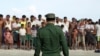 FILE - Rohingya Muslims wait to cross the border to Bangladesh, in a temporary camp outside Maungdaw, northern Rakhine state, Myanmar, Nov. 12, 2017. 