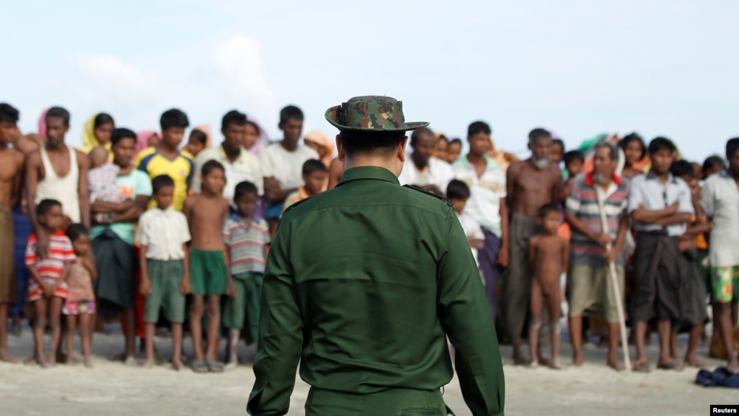 FILE - Rohingya Muslims wait to cross the border to Bangladesh, in a temporary camp outside Maungdaw, northern Rakhine state, Myanmar, Nov. 12, 2017. 