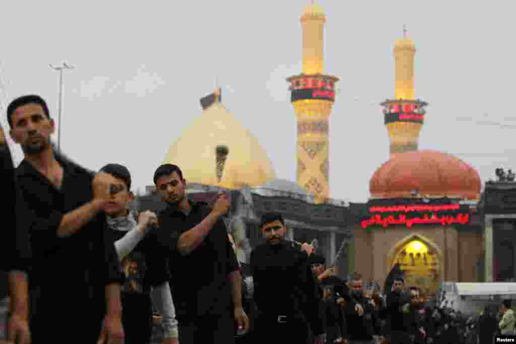 Shi'ite pilgrims beat themselves with iron chains as they take part in preparations for the Ashura ceremony in Kerbala, about 80 km southwest of Baghdad, November 23