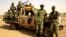 Soldiers from Burkina Faso stand guard at the airport, in Timbuktu, Mali, May 22, 2013.