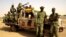 Soldiers from Burkina Faso stand guard at the airport, in Timbuktu, Mali, May 22, 2013.