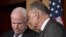 Sen. John McCain, R-Ariz., left, and Sen. Charles Schumer, D-N.Y., right, confer as they and other leading senators announce that they have reached agreement on the principles of sweeping legislation to rewrite the nation's immigration laws, during a news