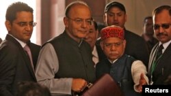 India's Finance Minister Arun Jaitley holds his briefcase as he arrives at the parliament to present the federal budget in New Delhi, India, Feb. 1, 2018.