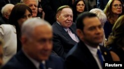 FILE - Sheldon Adelson, center, is seen during a reception at the King David Hotel, in Jerusalem, May 16, 2018.