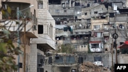 FILE - Israeli military vehicles enter the Tulkarem refugee camp during a raid on January 17, 2024, amid ongoing battles between Israel and the Palestinian militant group Hamas in Gaza. 