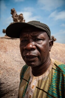 Sitor Diouf, the village chief of Guedj Martin, Senegal, poses for a portrait. (Annika Hammerschlag, for VOA)