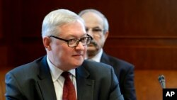 FILE - Russian Deputy Foreign Minister Sergei Ryabkov is seen participating in talks in Geneva, Switzerland, Oct. 15, 2013. Ryabkov says Russian government officials were in contact with members of Donald Trump campaign prior to Tuesday's election. 