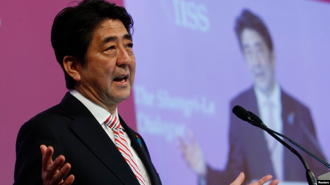 Japan's Prime Minister Shinzo Abe delivers the opening keynote address for the 13th International Institute for Strategic Studies (IISS) Asia Security Summit: The Shangri-La Dialogue, in Singapore May 30, 2014.
