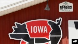 A sign hangs over the pork tent on the Iowa State Fairgrounds, June 10, 2020, in Des Moines, Iowa. This summer's Iowa State Fair was canceled Wednesday due to concerns about the coronavirus.