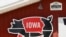 A sign hangs over the pork tent on the Iowa State Fairgrounds, June 10, 2020, in Des Moines, Iowa. This summer's Iowa State Fair was canceled Wednesday due to concerns about the coronavirus.
