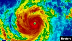 Super Typhoon Soudelor is seen in an enhanced infrared NOAA satellite image taken in the Western Pacific Ocean at 08:32 ET (12:32 GMT) August 4, 2015. 