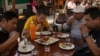 Custumers eat guinea pig at a restaurant in Lima, Peru, Oct. 3, 2024. 