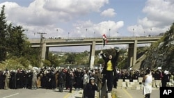 Women hold an anti-government demonstration in Banias, Syria, April 13, 2011