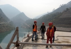 FILE - This photograph taken Oct. 31, 2017, shows Chinese engineers working on the Neelum-Jhelum Hydropower Project in Nosari, in Pakistan-administered Kashmir's Neelum Valley.
