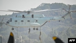 Soldiers demonstrate their combat capabilities by descending from a helicopter during the 15th China International Aviation and Aerospace Exhibition in Zhuhai, in south China's Guangdong province on November 12, 2024.