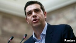 Greek Prime Minister Alexis Tsipras addresses members of his leftist Syriza party in the parliament Feb. 17, 2015. 