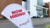 A sign at a Chicago grocery store advertises the availability of jobs Oct. 8, 2021.