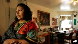 FILE - An illegal immigrant stands inside the Adalberto United Methodist Church in Chicago on May 15, 2008.