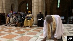 In this photo provided by Oryx Media, Anglican Archbishop Thabo Makgoba lays the ashes of Archbishop Emeritus Desmond Tutu to rest at the high altar of St. George&#39;s Cathedral, in Cape Town, South Africa.