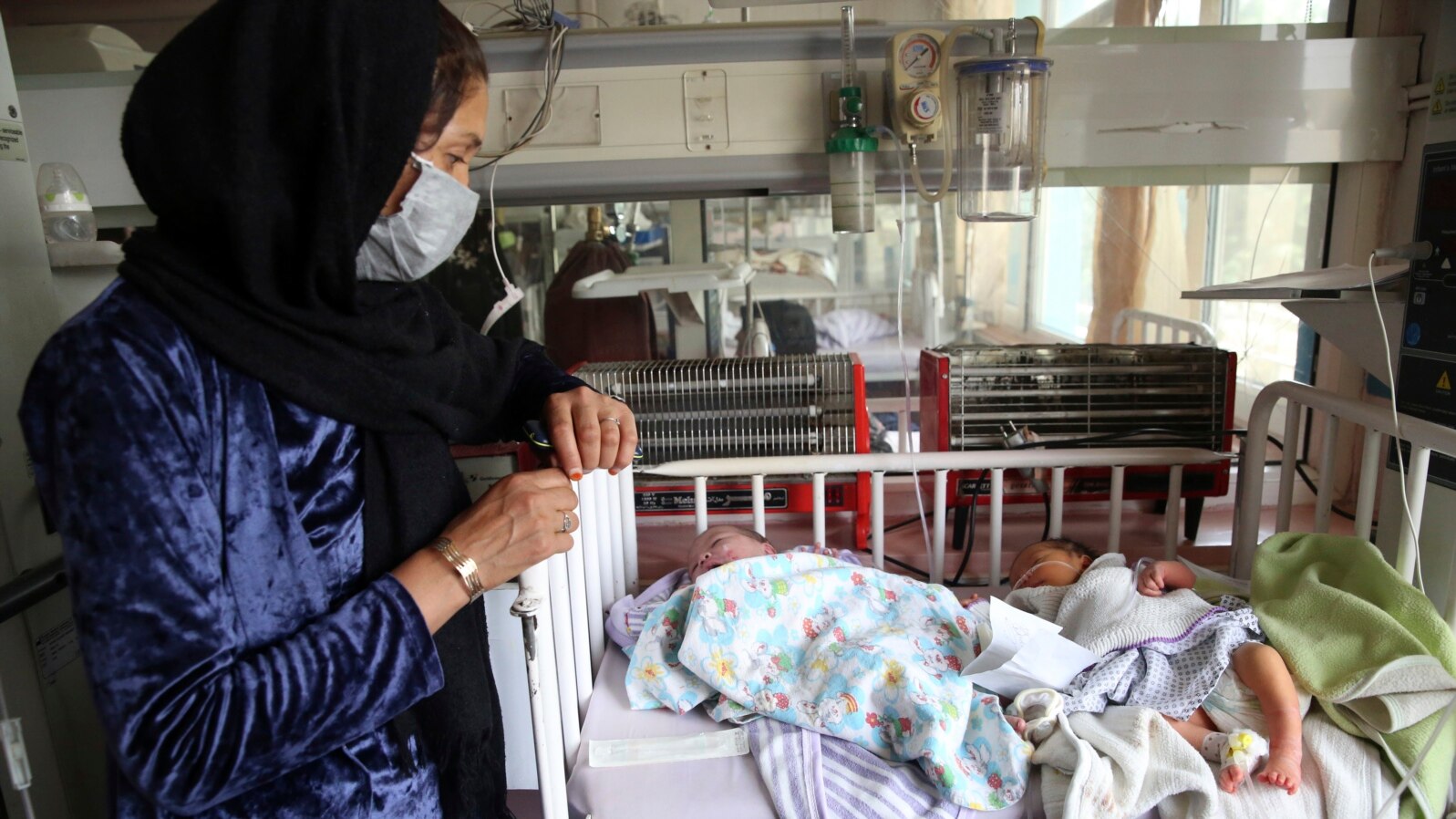 Babies lie in their beds at the Ataturk Children's Hospital a day after they were rescued following a deadly attack on another maternity hospital, in Kabul, Afghanistan, May 13, 2020. 