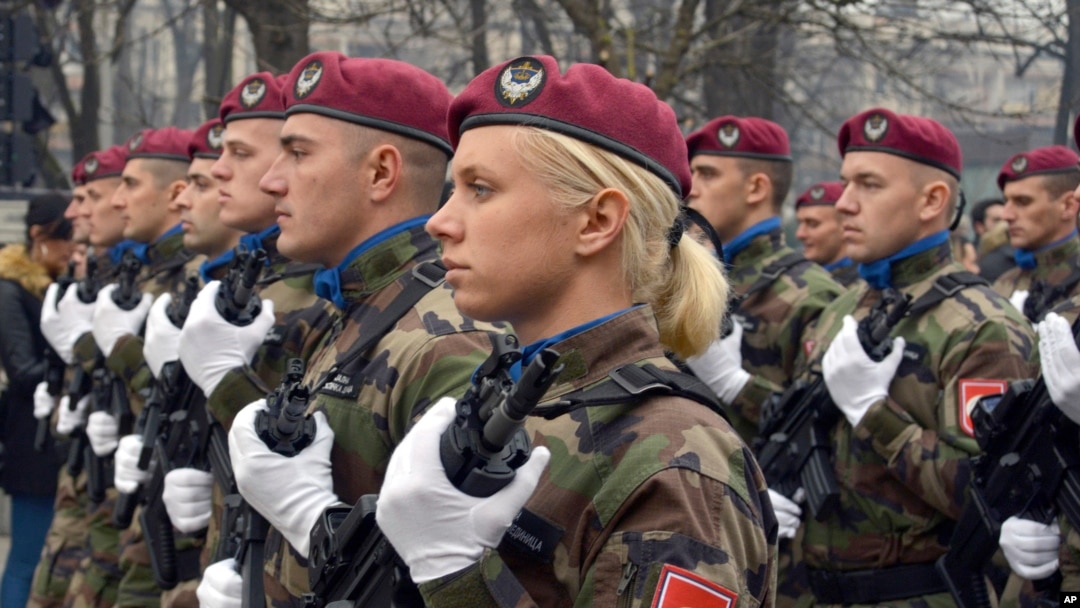 FILE - Members of the police forces of Republic of Srpska march during a parade marking the 26th anniversary of the Republic of Srpska in the Bosnian town of Banja Luka, Jan. 9, 2018. The January 9 holiday commemorates the date in 1992 when Bosnian Serbs declared the creation of their own state in Bosnia, igniting the country's four-year war.