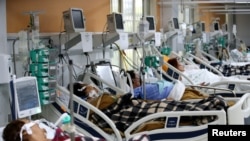 Patients are treated in the emergency room of the Nossa Senhora da Conceicao hospital that is overcrowding because of the coronavirus outbreak, in Porto Alegre, Brazil, March 11, 2021. 