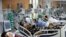 Patients are treated in the emergency room of the Nossa Senhora da Conceicao hospital that is overcrowding because of the coronavirus outbreak, in Porto Alegre, Brazil, March 11, 2021. 