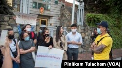 Two groups of protesters confront each other in Washington, DC, over different views on Thai politics, leading to a heated conversation in front of the Royal Thai Embassy. 