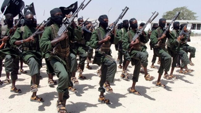 FILE - Al-Shabab fighters march during military exercises in the Lafofe area, 18 kilometers south of Mogadishu, Somalia, Feb. 17, 2011.