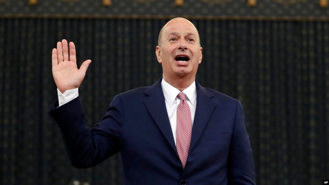 U.S. Ambassador to the European Union Gordon Sondland is sworn in to testify before the House Intelligence Committee on Capitol Hill in Washington, Nov. 20, 2019, during a public impeachment hearing of President Donald Trump.