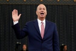 FILE - U.S. Ambassador to the European Union Gordon Sondland is sworn in to testify before the House Intelligence Committee on Capitol Hill in Washington, Nov. 20, 2019, during a public impeachment hearing of President Donald Trump.