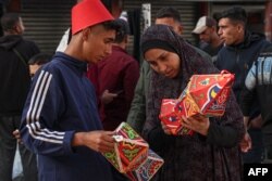 FILE —A Palestinian street vendor sells traditional "fanous" lanterns as Muslim devotees prepare for Ramadan, in Rafah on March 5, 2024.