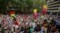 Protesters hold placards during a climate change rally in Sydney, Jan. 10, 2020.