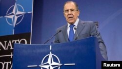 Russia's Foreign Minister Sergei Lavrov addresses a news conference after a NATO-Russia foreign ministers meeting at the Alliance headquarters in Brussels, Dec. 4, 2013.