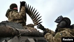 Ukrainian service members load ammunition to an infantry fighting vehicle during offensive and assault drills, amid Russia's attack on Ukraine, in Zaporizhzhia Region, Ukraine Jan. 23, 2023.