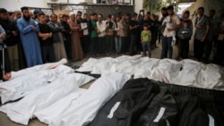 Mourners pray and gather near the bodies of Palestinians killed in Israeli strikes, amid the ongoing conflict between Israel and the Palestinian Islamist group Hamas, during their funeral in Rafah, in the southern Gaza Strip, April 29, 2024.