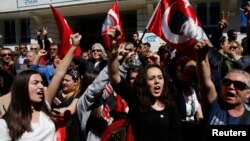 FILE - Supporters of Republican People's Party (CHP) shout anti-government slogans outside the Supreme Electoral Council (YSK) in Ankara, April 1, 2014. 