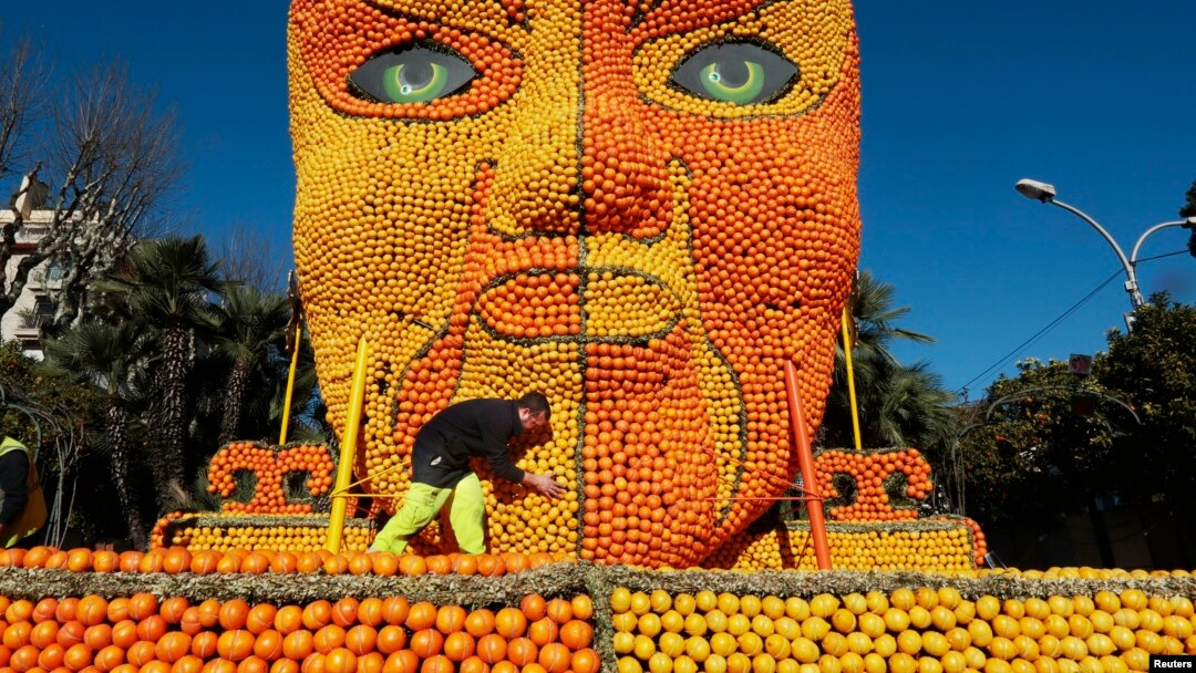 A worker puts the final touches to a Beijing opera mask made with lemons and oranges. This was part of the 82th Lemon festival in Menton, France 2015. (Photo REUTERS/Eric Gaillard)
