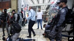 Israeli police arrests a Palestinian during a protest demanding a release of Heba al-Labadi, a Jordanian citizen of Palestinian descent, in east Jerusalem, Oct. 26, 2019.