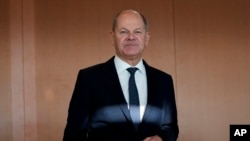 FILE - German Chancellor Olaf Scholz arrives for a German government cabinet meeting at the chancellery in Berlin, Germany, Nov. 27, 2024.